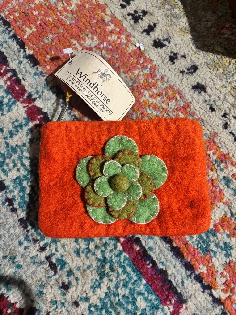 Windhorse Orange Felt Wristlet with Green Floral Applique